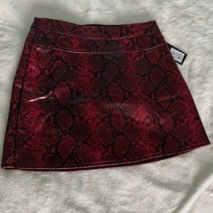 Faux leather snake print skirt in red and black